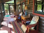 Large screened in back porch with a view of the river